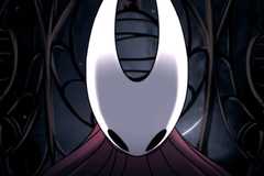 Hornet stands dramatically in a cage in Hollow Knight Silksong